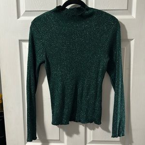 Metallic green mock neck top with ruffle trim